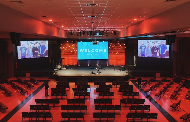 Full stage and partial room view of Highland Baptist Church in Waco, TX